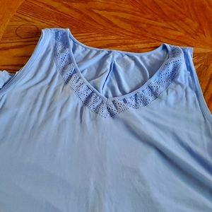 Light blue dressy sleeveless shirt. Great length.